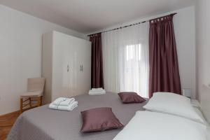Postel nebo postele na pokoji v ubytování Apartments Tolic