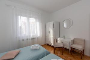 Postel nebo postele na pokoji v ubytování Apartments Tolic