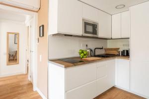 A kitchen or kitchenette at Sea view, pool, free parking, wifi, Port Aventura