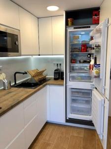 A kitchen or kitchenette at Sea view, pool, free parking, wifi, Port Aventura