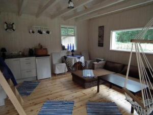 a living room with a couch and a table at Tirbi Holiday House in Kassari