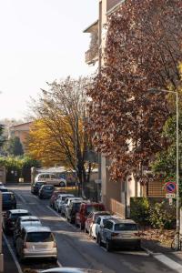 a street with cars parked on the side of a building at Casa Martina- Airport free shuttle-H24 in Bergamo