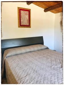 Un pat sau paturi într-o cameră la Casa DiEle