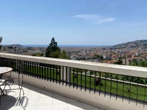 a balcony with a view of a city at Dernier Etage d'exception in Nice
