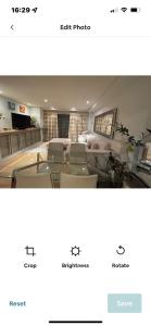 a picture of a room with chairs and a table at Central London 1 bed Apartment in London