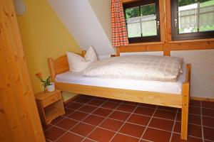 a bedroom with a bed and a window at Ober der Eller in Brotterode