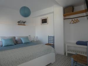 En eller flere senge i et værelse på Casa Alegría