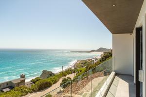 a balcony with a view of the ocean at Beyond Misty Cliffs in Scarborough