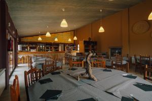 a dining room with a table with a statue on it at Slow Life Camping Venta del Moro in Venta del Moro