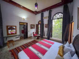 Postel nebo postele na pokoji v ubytování Riad Pacha Palace