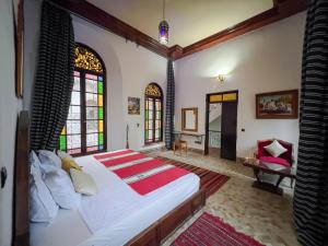 Postel nebo postele na pokoji v ubytování Riad Pacha Palace