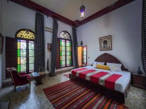 Postel nebo postele na pokoji v ubytování Riad Pacha Palace