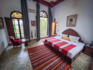Postel nebo postele na pokoji v ubytování Riad Pacha Palace