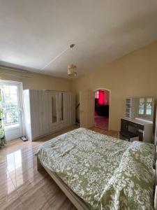 a bedroom with a bed and a sink in it at Baie du Tombeau Apartment in Baie du Tombeau