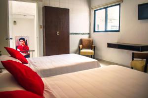 Postel nebo postele na pokoji v ubytování Hotel Cupules