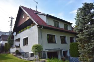 a white house with a red roof at Penzion243 in Tábor
