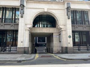 an entrance to a building with an archway at Central London 1 bed Apartment in London