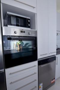 Kuchyň nebo kuchyňský kout v ubytování Kinder Apartman