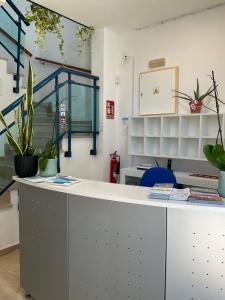 a room with a counter with plants on it at Pension Campello The Blue Med in Alicante