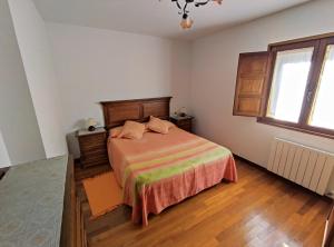Postel nebo postele na pokoji v ubytování La Huertona