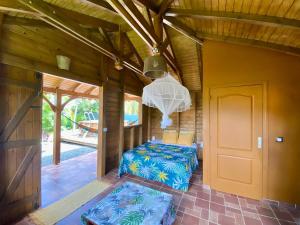 Postel nebo postele na pokoji v ubytování Bungalow Kataliya