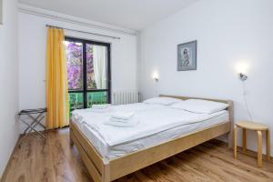 a bedroom with a large bed and a window at Apartments with parking space Pjescana Uvala, Pula - 7349 in Pula