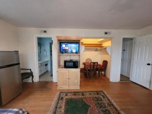 a living room with a kitchen and a dining room at Virginia Vacation duplex house 1 in Virginia Beach