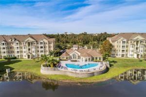an aerial view of a large apartment complex with a swimming pool at COZY Condo - Perfect Location Close to Disney in Kissimmee