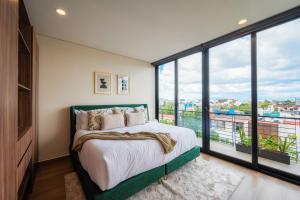 Postel nebo postele na pokoji v ubytování Capitalia Downtown Del Valle + 48 fotografií