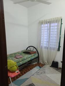 Posteľ alebo postele v izbe v ubytovaní Sobey Laris Homestay KokLanas