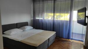 Posteľ alebo postele v izbe v ubytovaní Apartments with WiFi Split - 19928