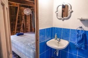 a bathroom with a sink and a bed at Rancho Estero in Santa Catalina