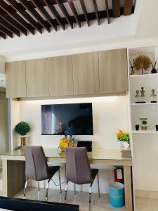 TV a/nebo společenská místnost v ubytování Inspiria Cozy Condo + 24 fotografií