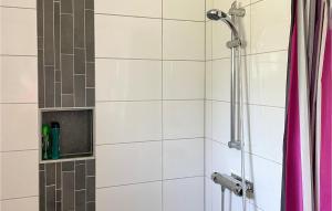 a bathroom with a shower with a shower curtain at Beautiful Home In Tived With Wifi in Tived