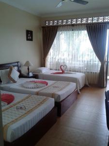 Postel nebo postele na pokoji v ubytování TIEN DAT MUI NE Resort & Spa