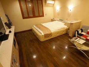 Giường trong phòng chung tại グリーンヒル　大人専用