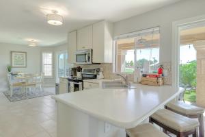 a kitchen with white cabinets and a counter top at Luxe on the Links in Phoenix
