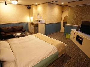 Giường trong phòng chung tại グリーンヒル　大人専用