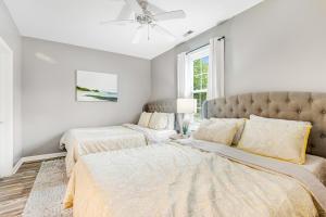 a bedroom with two beds and a ceiling fan at Sandpiper Village --- 35552 E Atlantic Cir #101 in Rehoboth Beach
