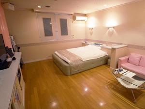 Giường trong phòng chung tại グリーンヒル　大人専用