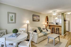 a living room with a couch and a table at Hilton Head Resort 2314 in Hilton Head Island