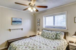 a bedroom with a bed and a ceiling fan at Hilton Head Resort 2314 in Hilton Head Island +27 photos