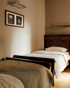 Posteľ alebo postele v izbe v ubytovaní Hotel Monopol
