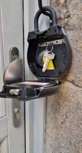 a lock on a door with a key in it at Studio dans Quartier historique de MOULINS in Moulins