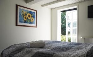 Rúm í herbergi á Sunbjerre B&B