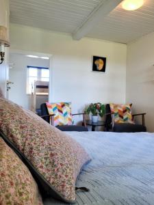 Rúm í herbergi á Sunbjerre B&B