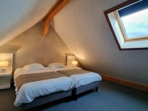 Postel nebo postele na pokoji v ubytování Hôtel Le Dormeur