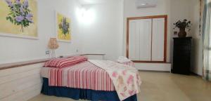 Postel nebo postele na pokoji v ubytování I Mirti - Home Holiday
