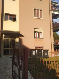 a building with a fence in front of it at Creazzo Tree in Creazzo