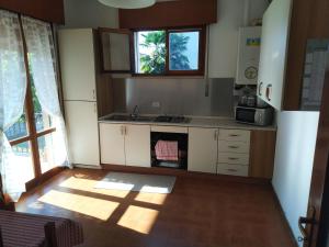 a kitchen with a sink and a stove top oven at Creazzo Tree in Creazzo